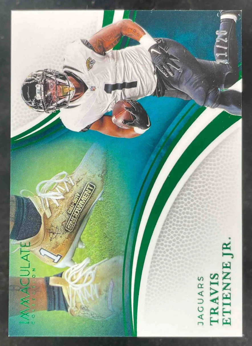 2025 Immaculate Collection Emerald #64 Travis Etienne Jr. Cleat Variation /26